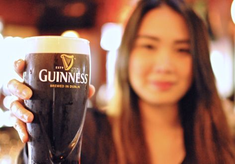 bartender holding guinness