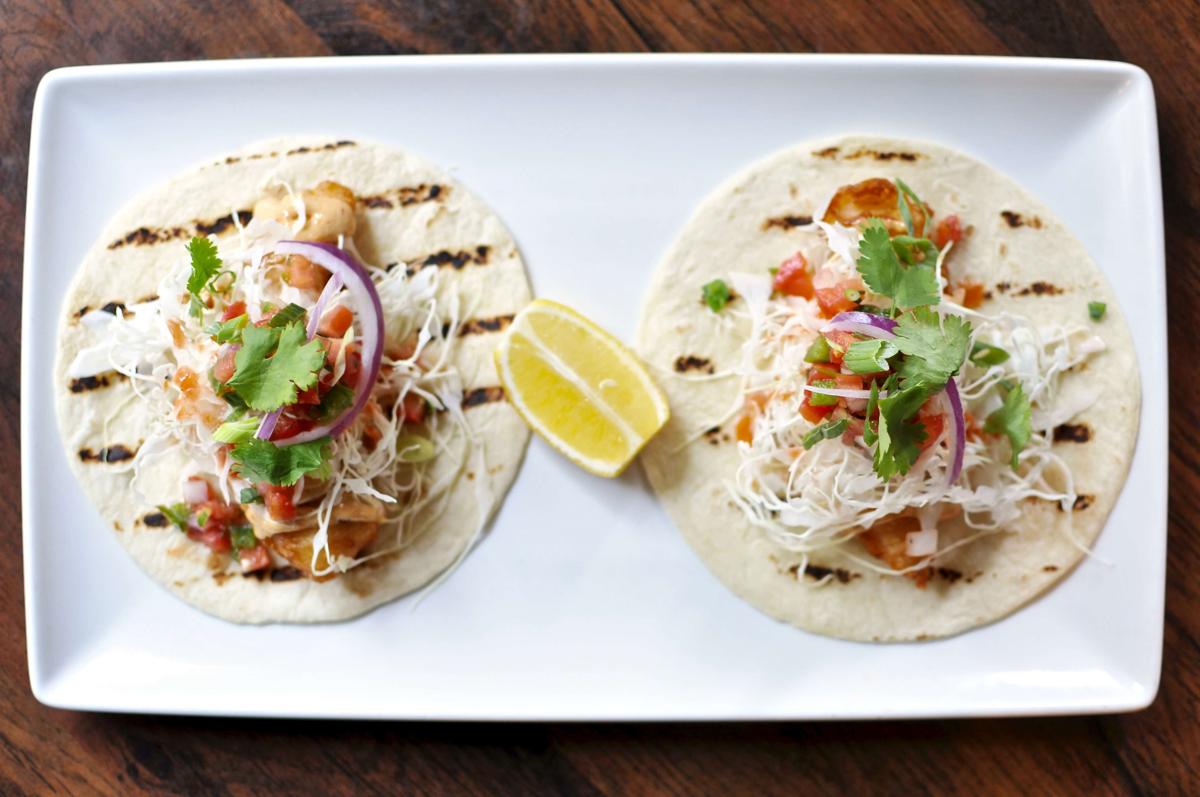 a plate with two tacos