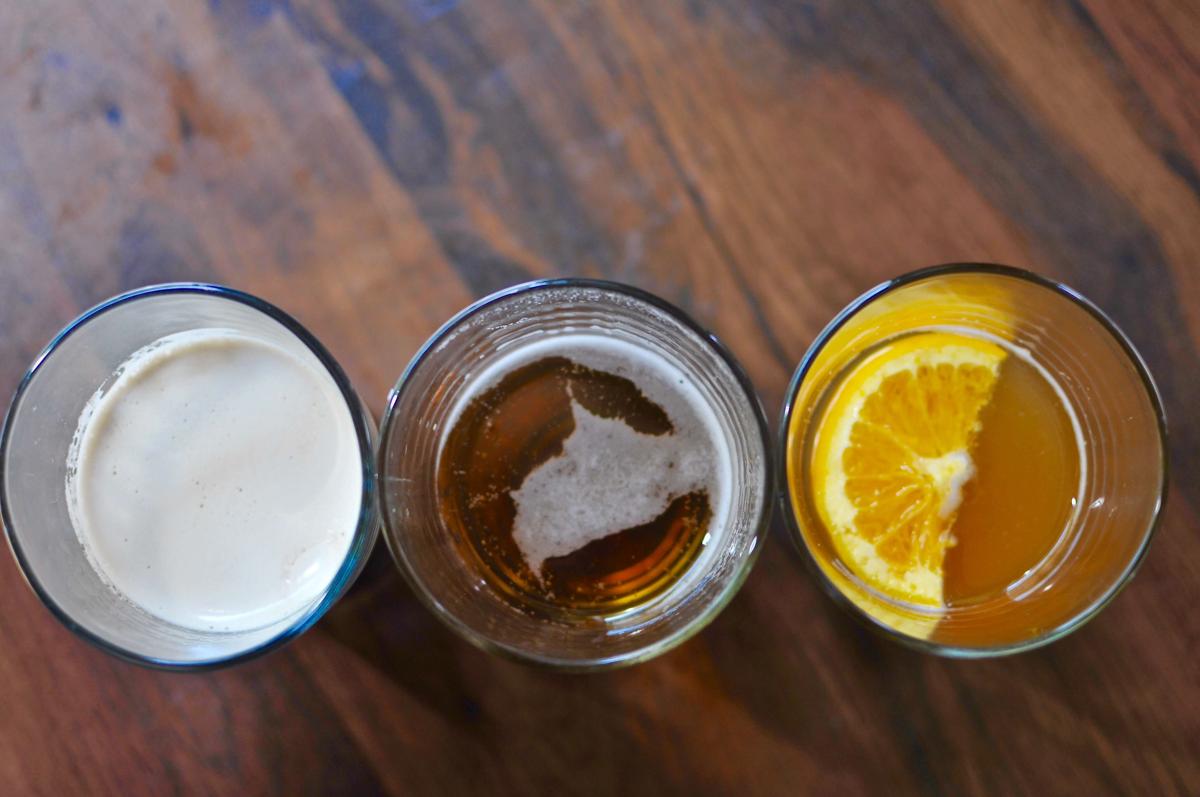 three glasses of beer lined up