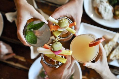 people cheersing brunch cocktails